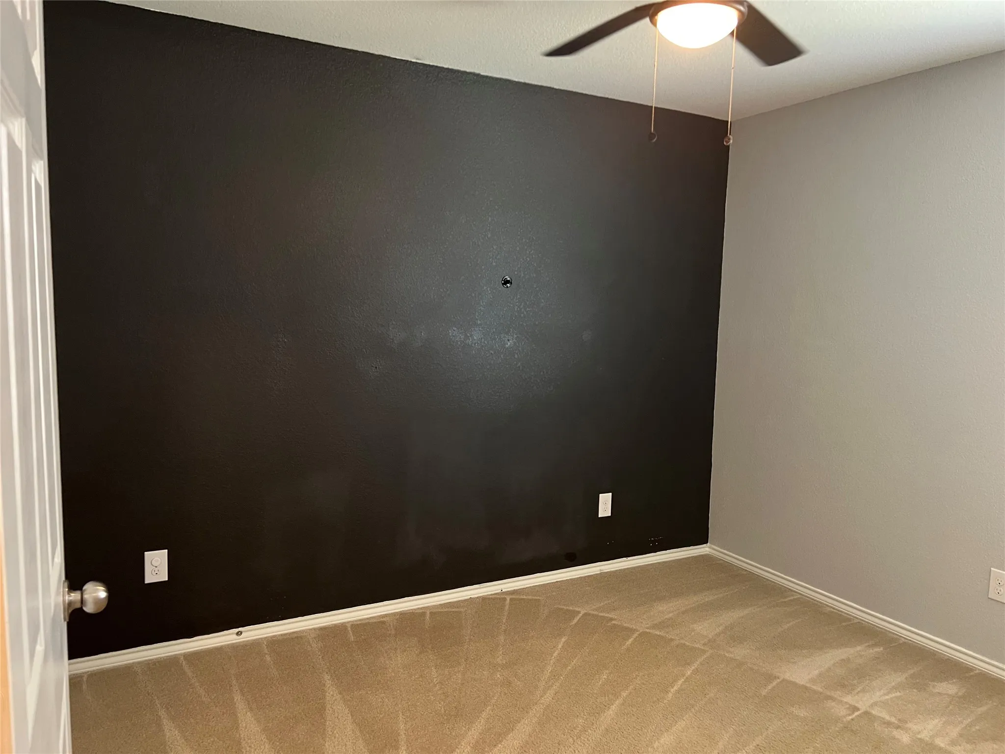 Bedroom with ceiling fan.