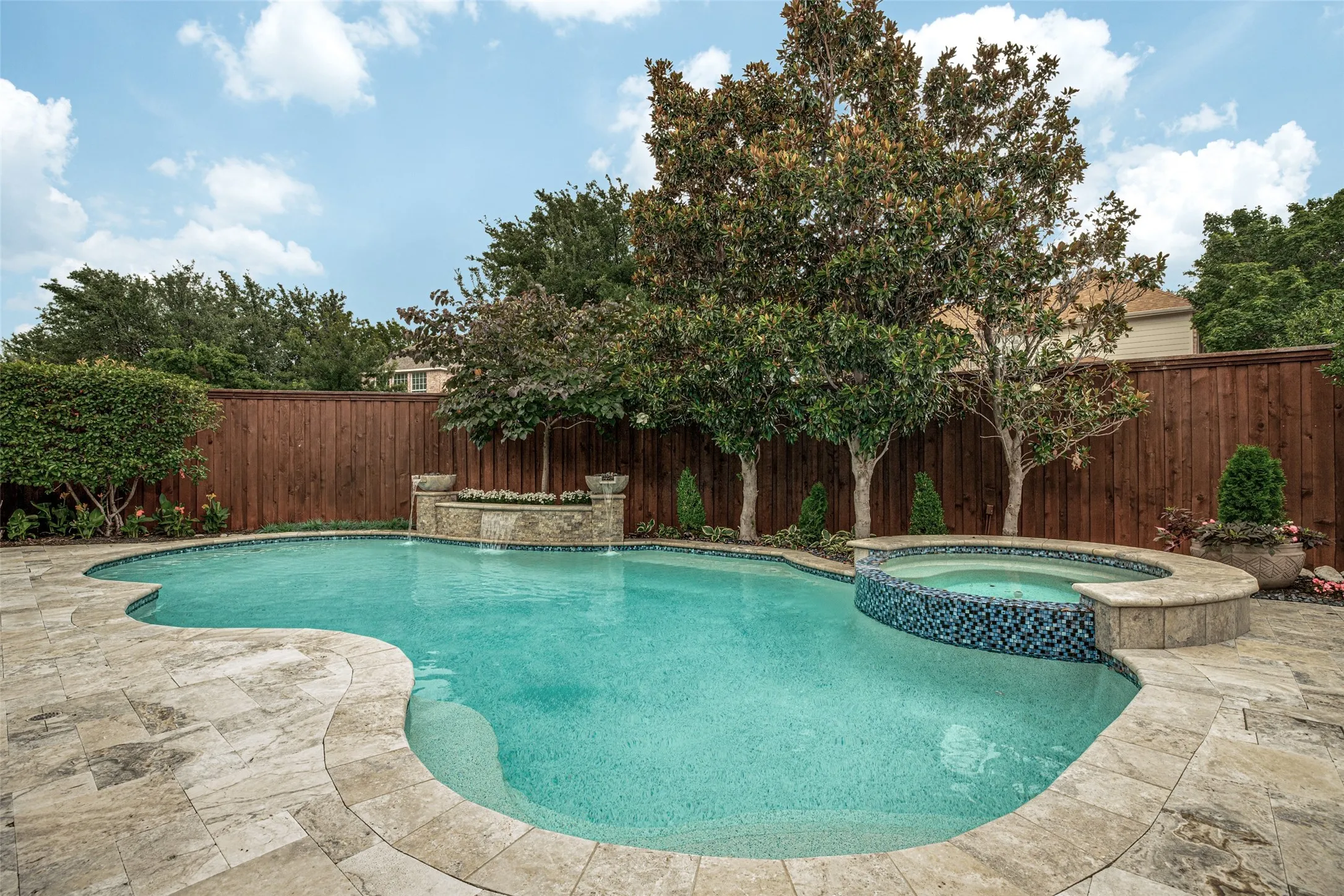 The backyard has nice privacy and abundant attractive landscaping.  There are grassy areas on the sides for pets and play.  The full yard sprinkler system was converted to a NETRO wireless watering system.  This exciting home has so many terrific features, upgrades and updates!  It is convenient to popular shopping, dining and entertainment, and students can go to some of the most highly acclaimed schools in the city.
