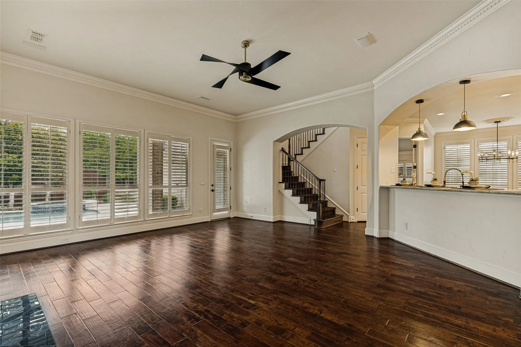 A very popular feature of the home is the back staircase.  Quick access from the gameroom and bedrooms upstairs to the family room and kitchen below is convenient.  Speakers are in the ceiling of the family room for media enjoyment.