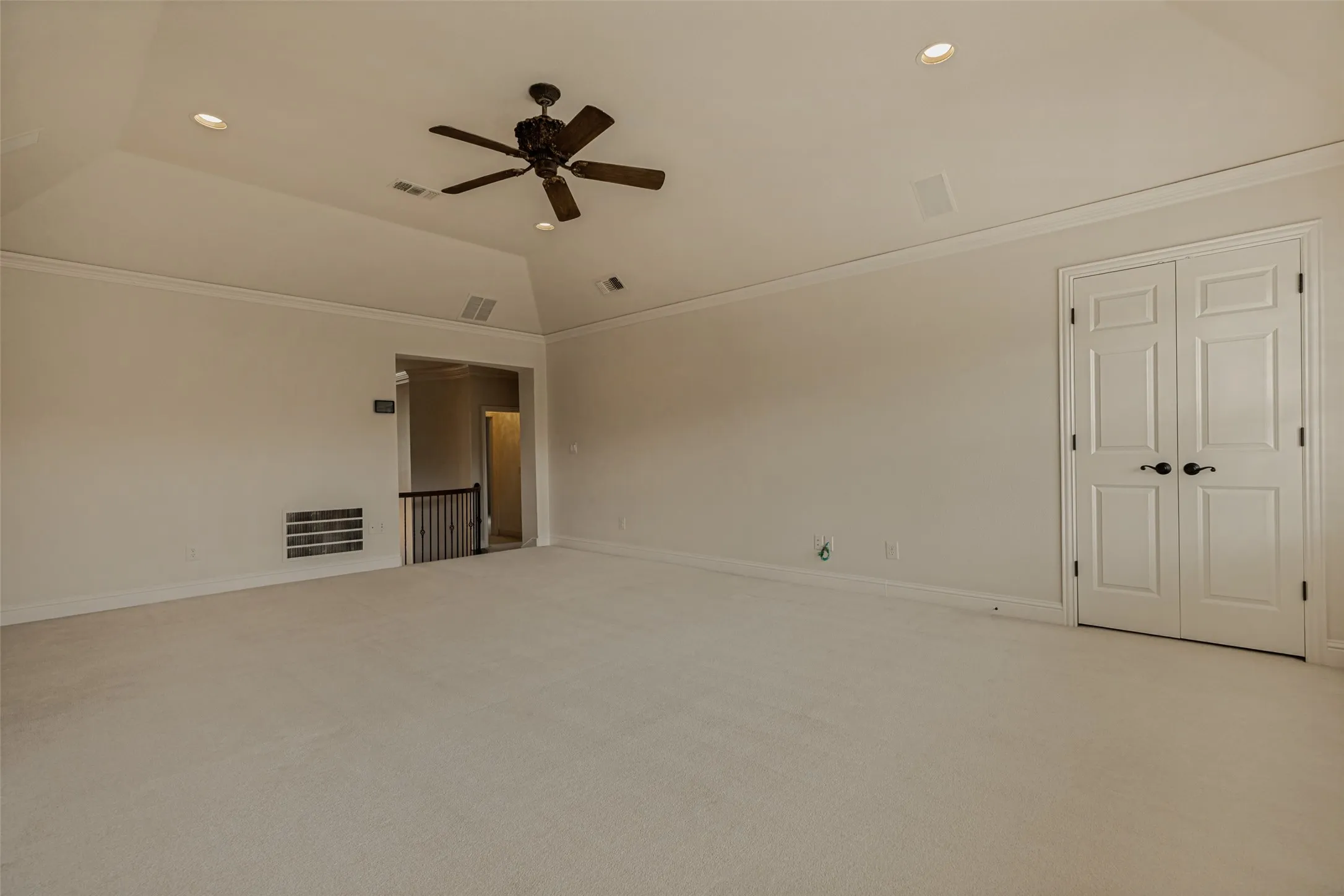 Crown molding and speakers are at the ceiling in the gameroom.  Entry to the room from both the front and back of the house is easy with dual stairs.  A wide storage closet is handy for games or toys.  Several large closets, walk-in closets in all bedrooms and four attic accesses - including two that are walk-in - all create abundant storage in the home.