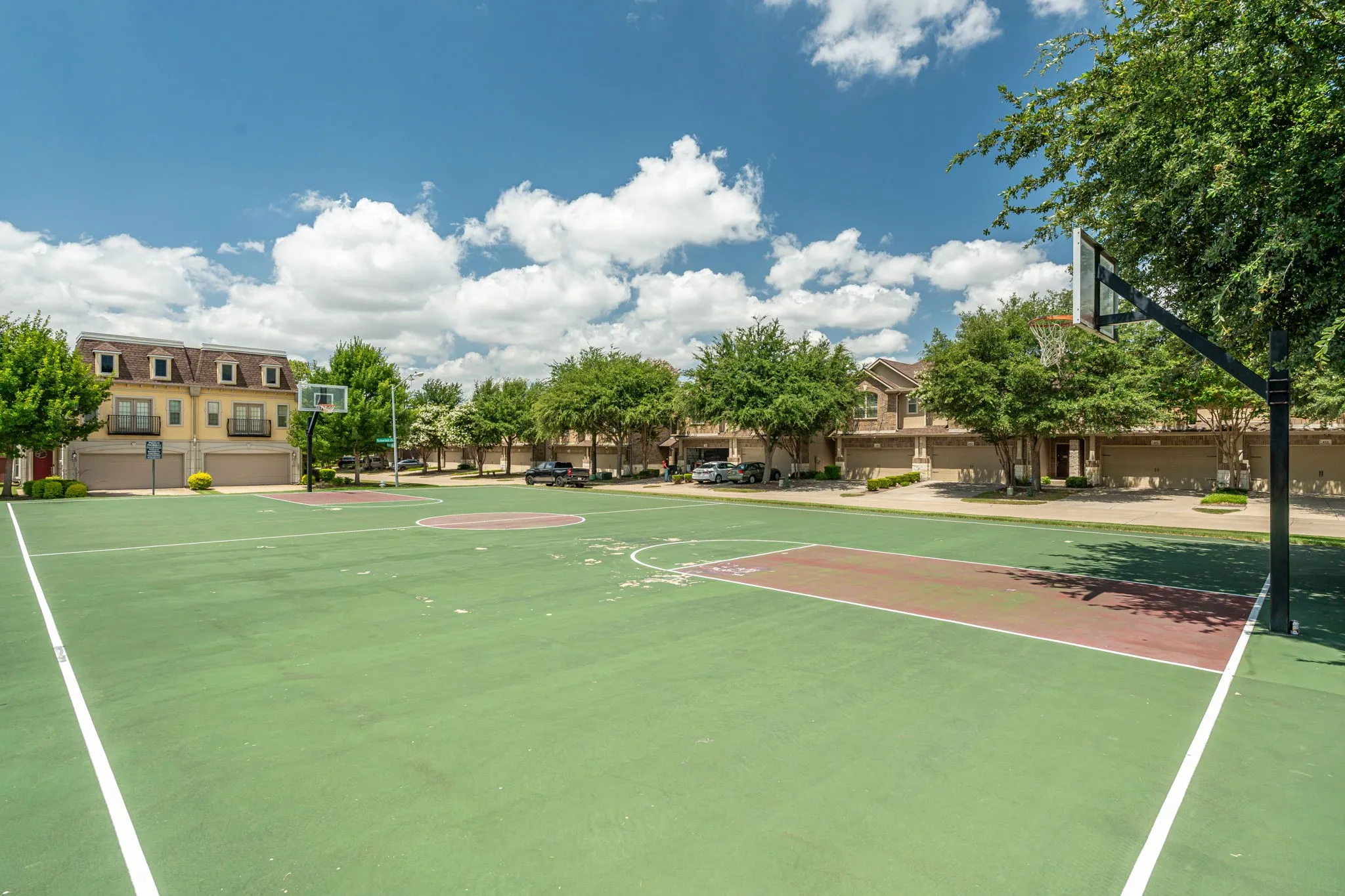 Neighborhood basketball court within the community amenities.