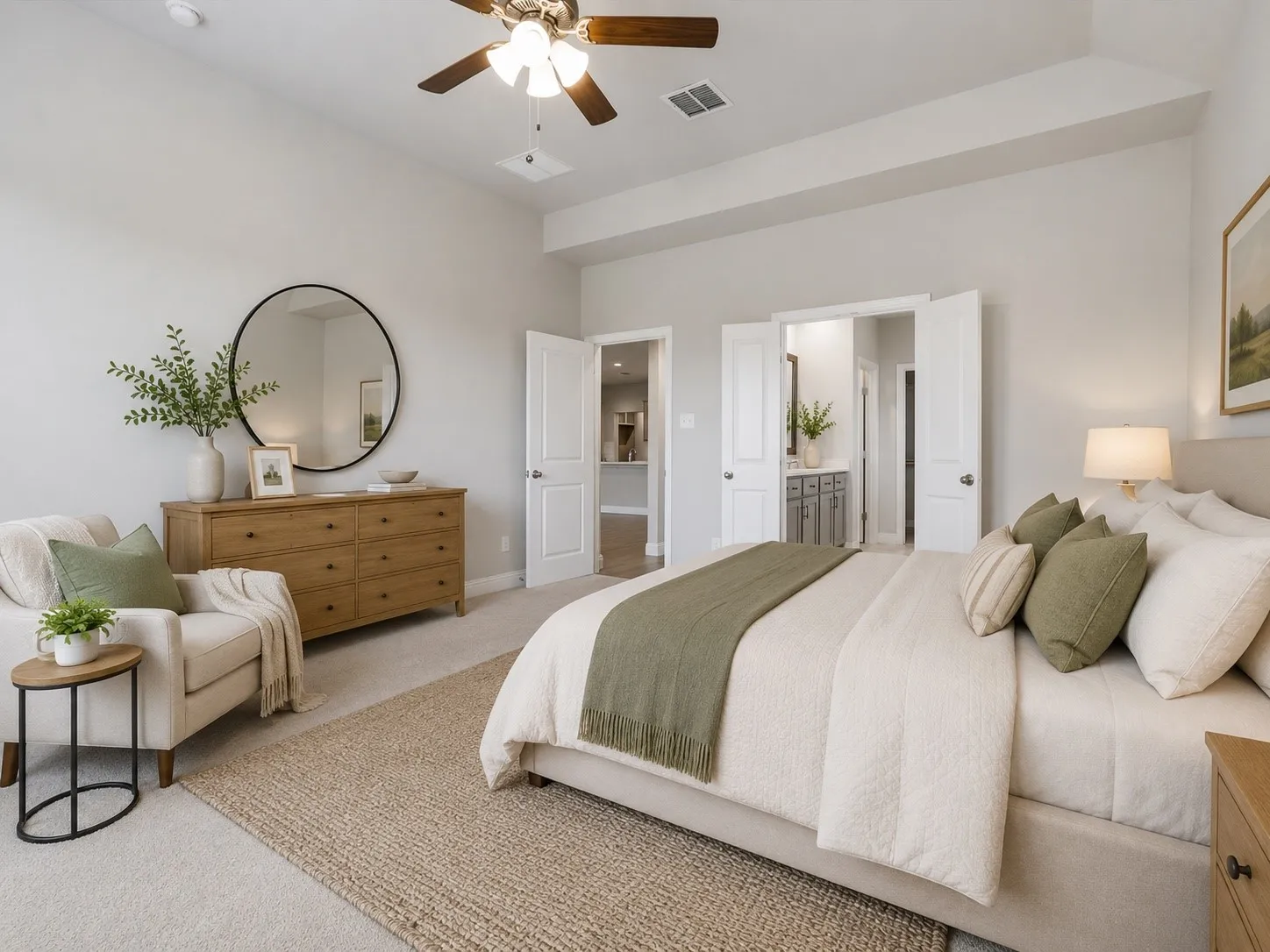 Spacious room featuring light gray walls and plush carpeting