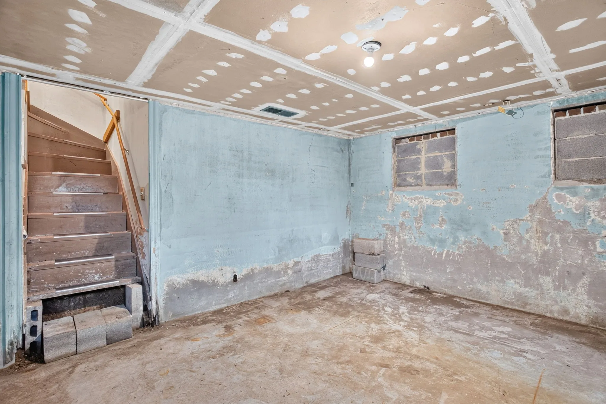Storm shelter - storage - a fun space for a card room. Sump pump helps remove water; HVAC vent helps with humidity. It IS a basement.