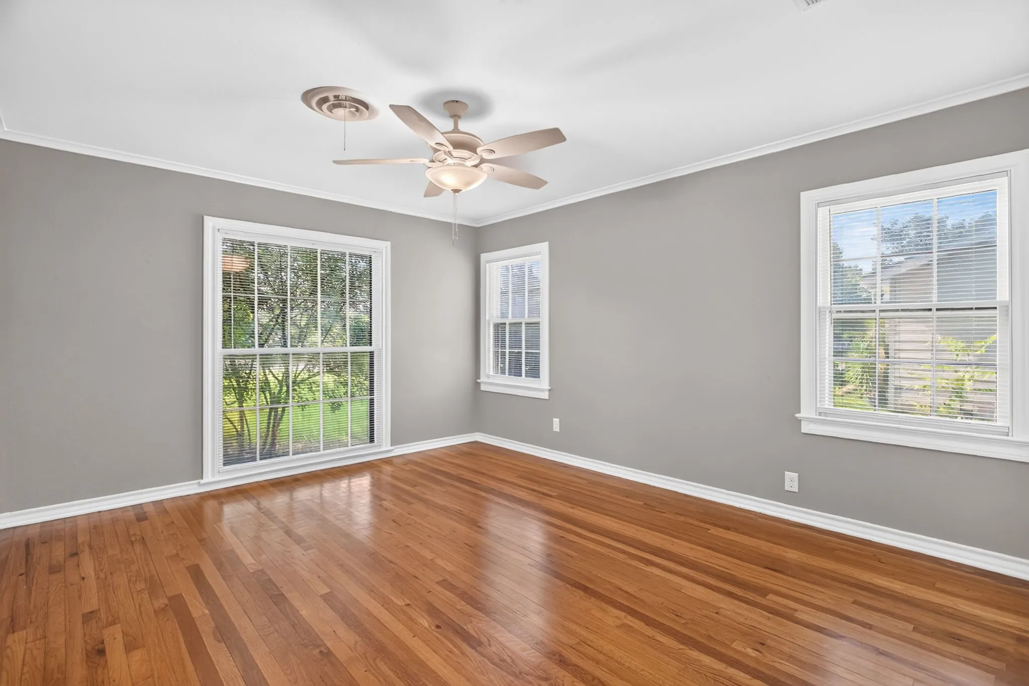 Front facing bedroom with a beautiful window. These bedrooms are so spacious.