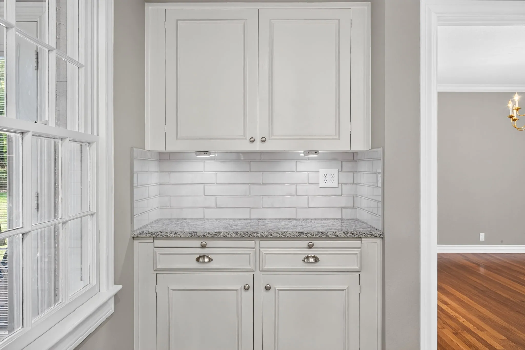 Connects to the dining room. The under cabinet lights are a nice touch!