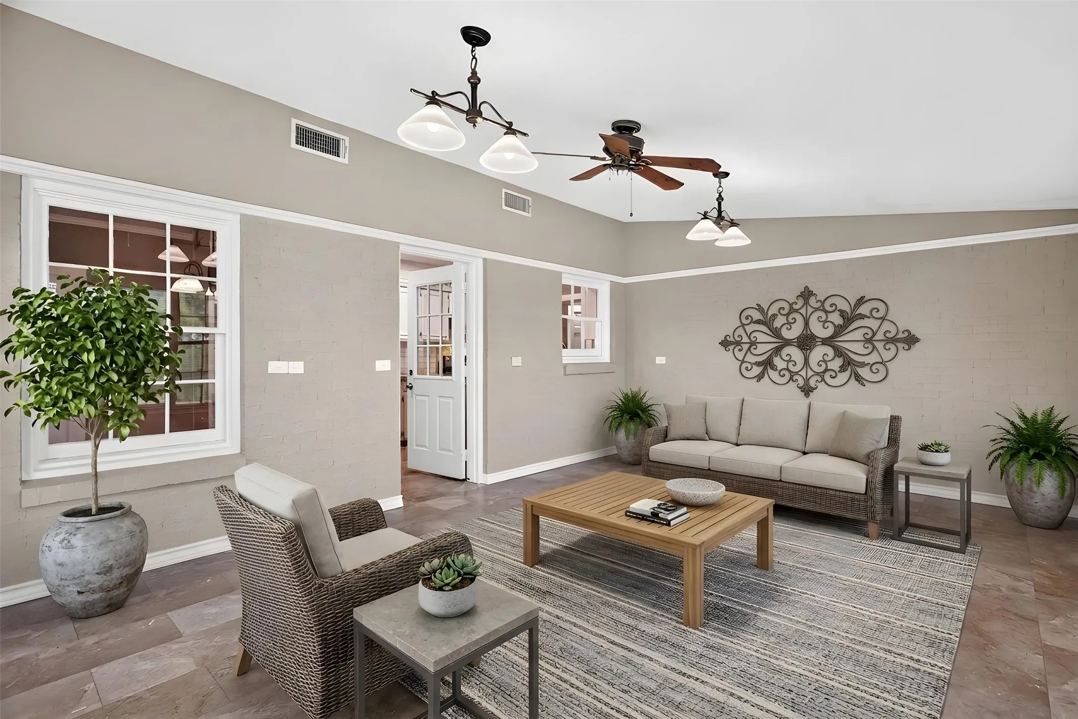 Virtually Staged: the enclosed sunroom is connected to central AC and perfectly improved for another lovely gathering space.