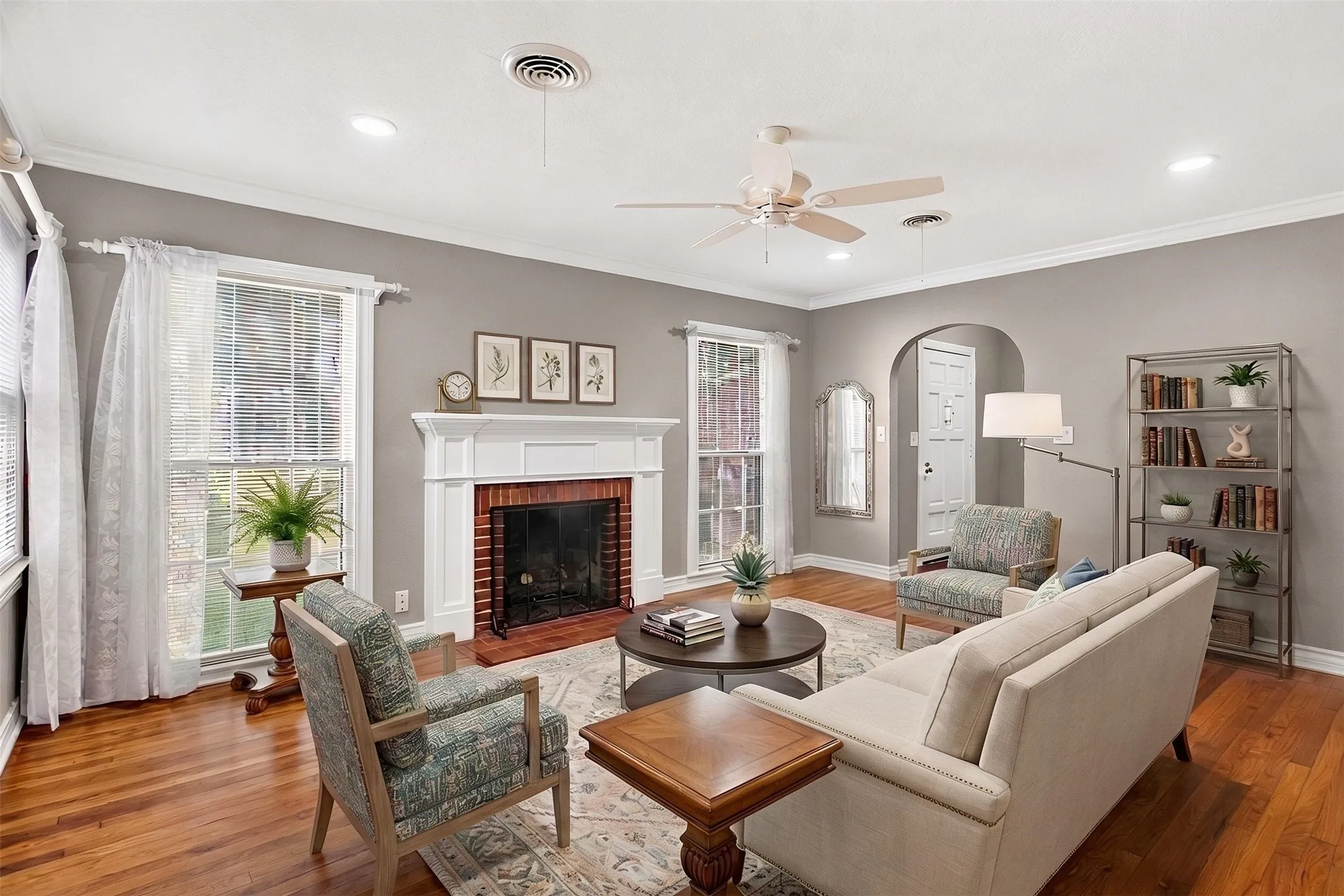 Virtually Staged: the perfect blend of old and new. Original hardwoods, old school fireplace, and recessed lighting with updated electrical.