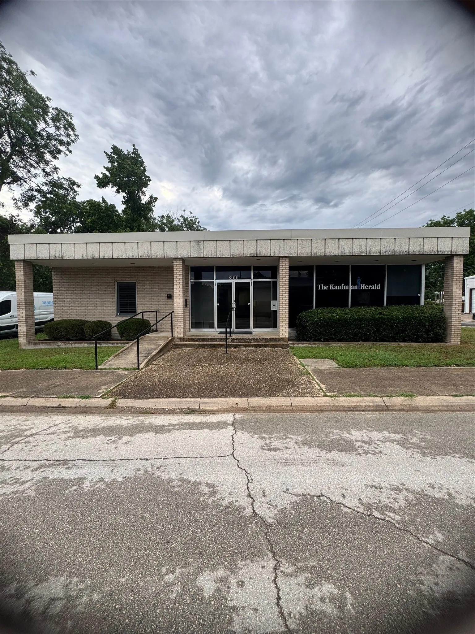 Commercial building featuring a brick facade with a flat roofline