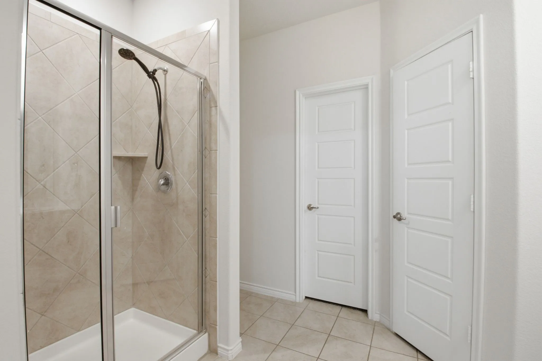 Primary Shower With Seating Area