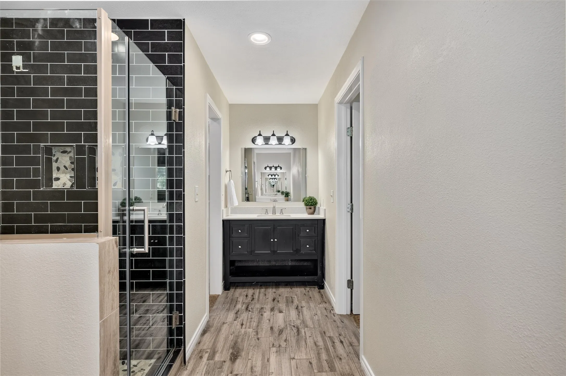 2 separate vanities and 2 separate walk-in closets