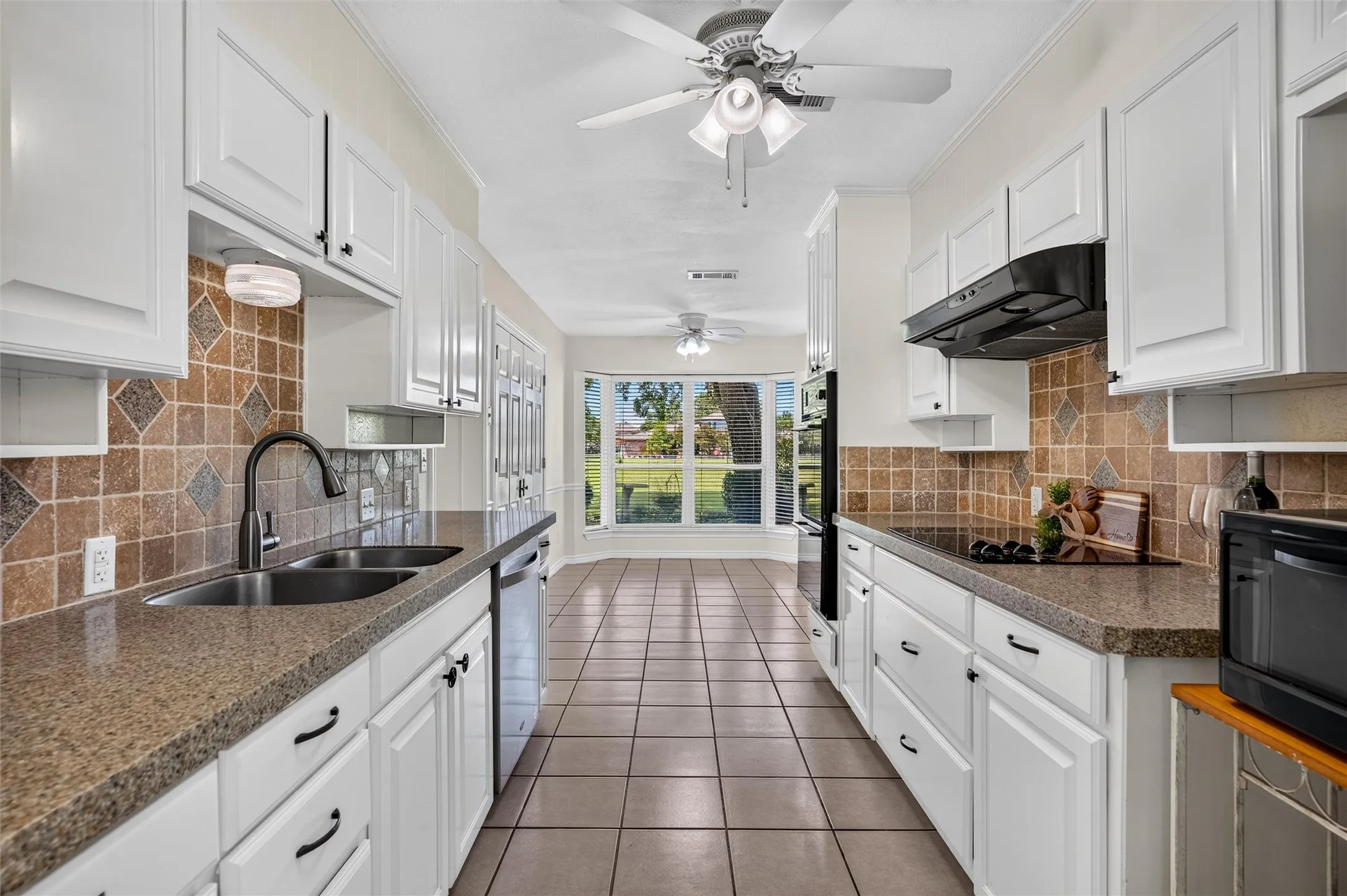 Newer appliances & newer cabinet doors, ctops and backsplash