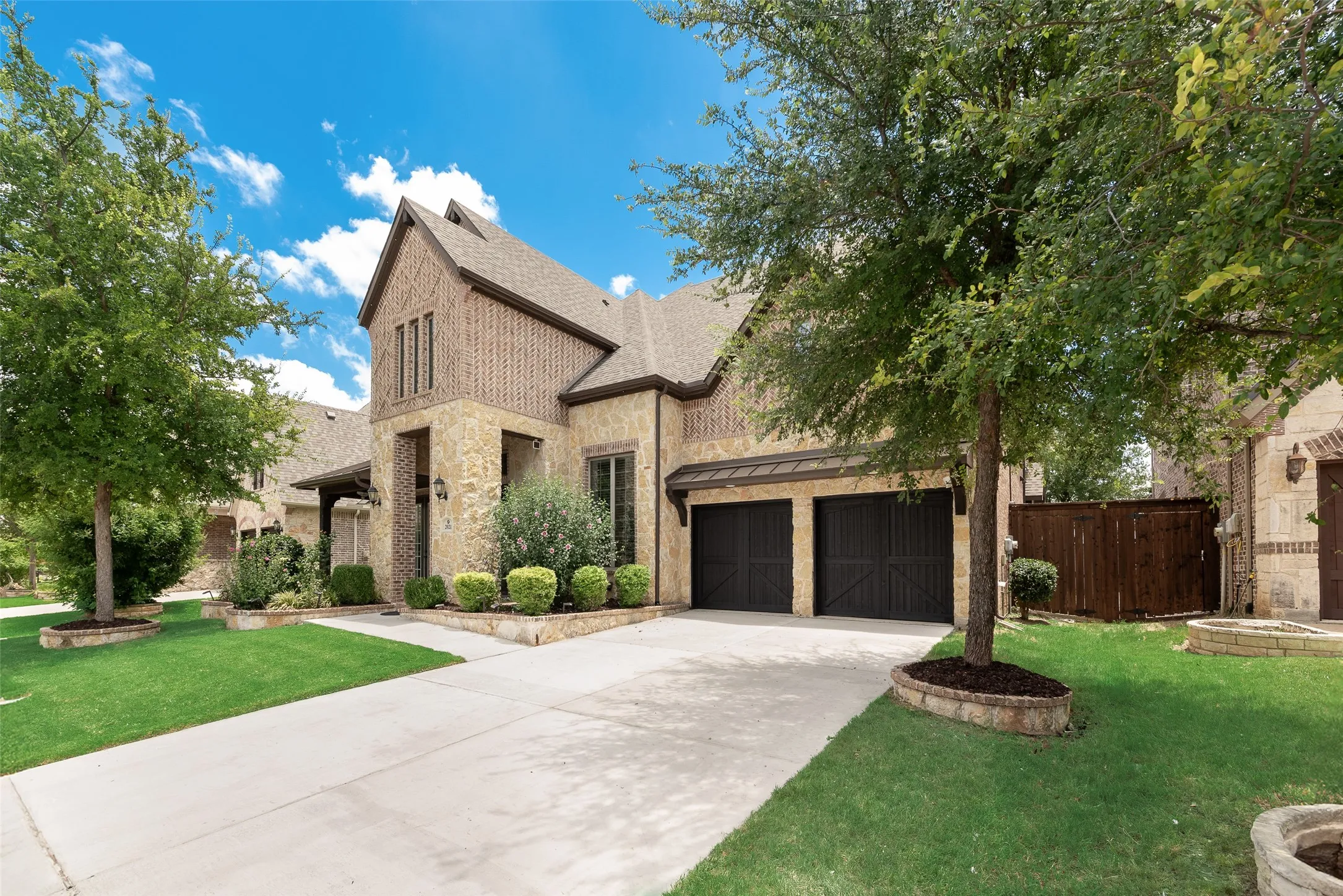 Stone and brick exterior with a multi-level roofline