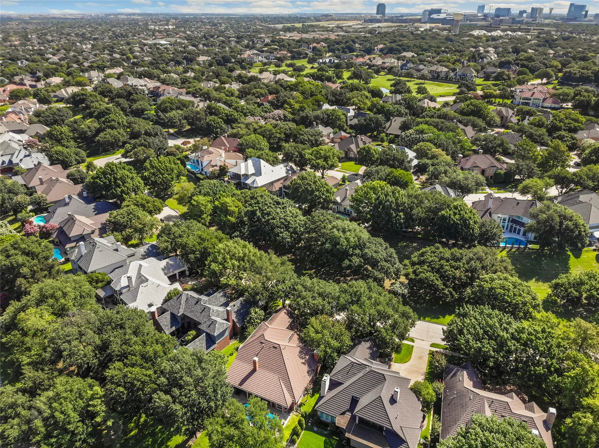 Greenbelt in front with a park at the end of the block out front. Out the backyard gate and down the greenspace is another park.