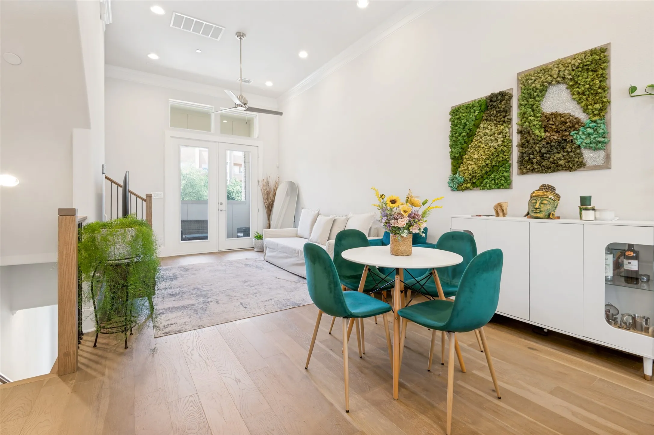 Open-concept living space featuring high ceilings, recessed lighting, and light wood-finish flooring