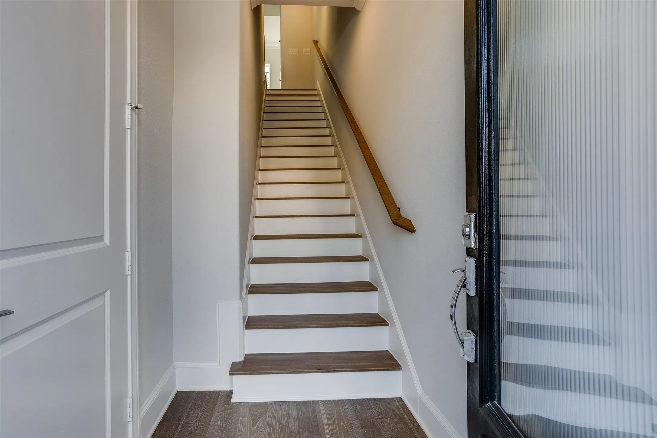 Staircase with wood-finish treads and white risers