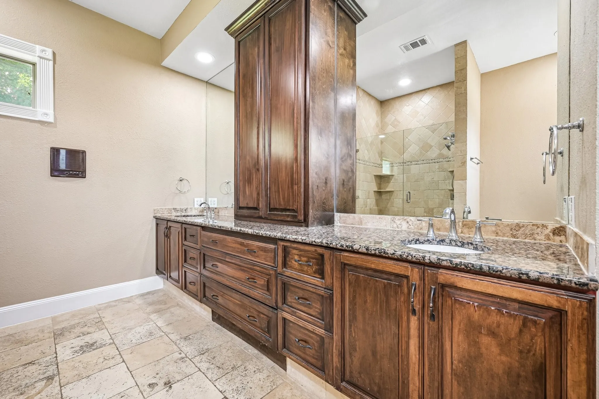 spa-inspired ensuite bath with separate vanities, and separate walk-in shower