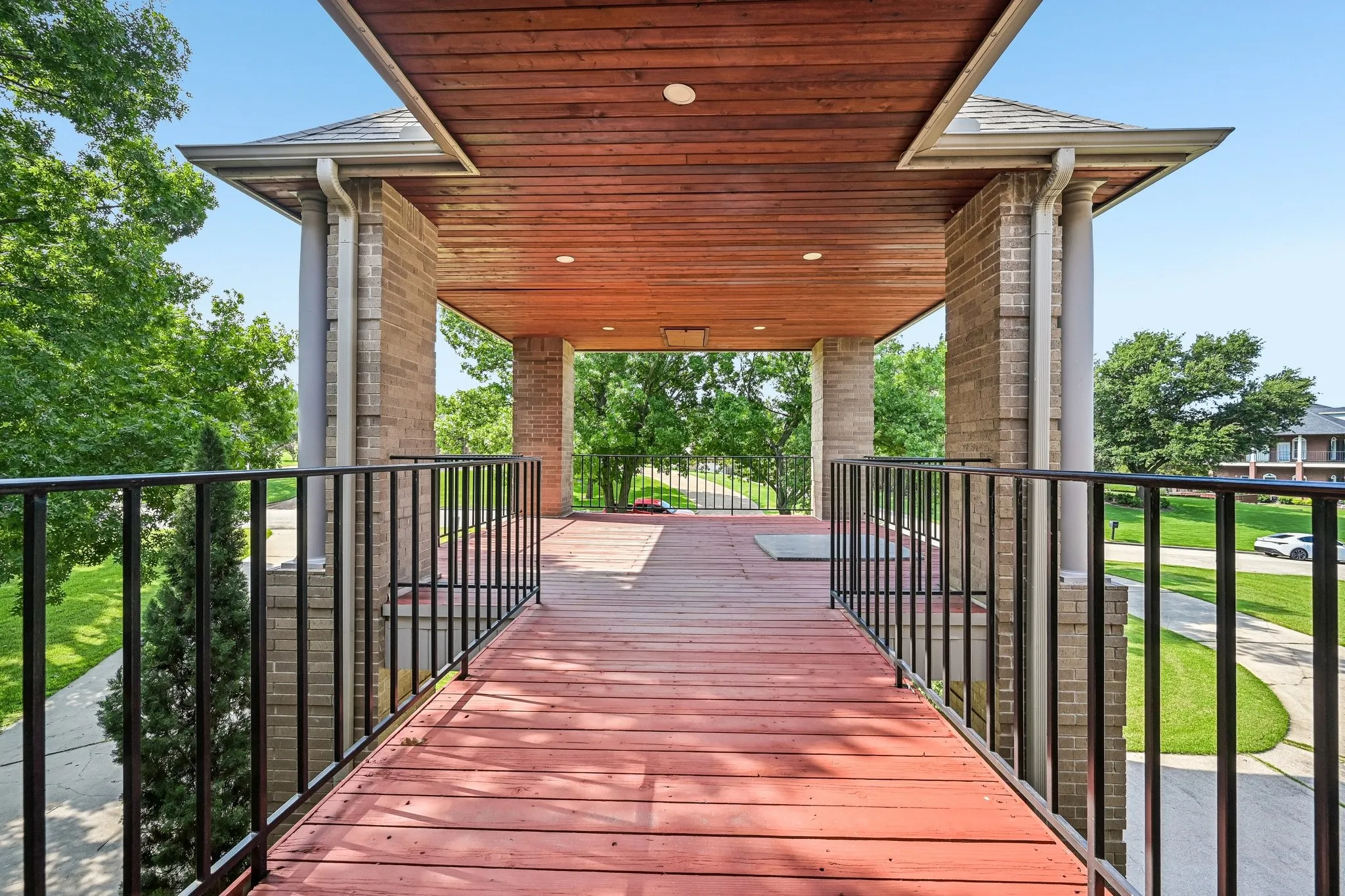 Relax on the covered balcony over the stately porte-cochère