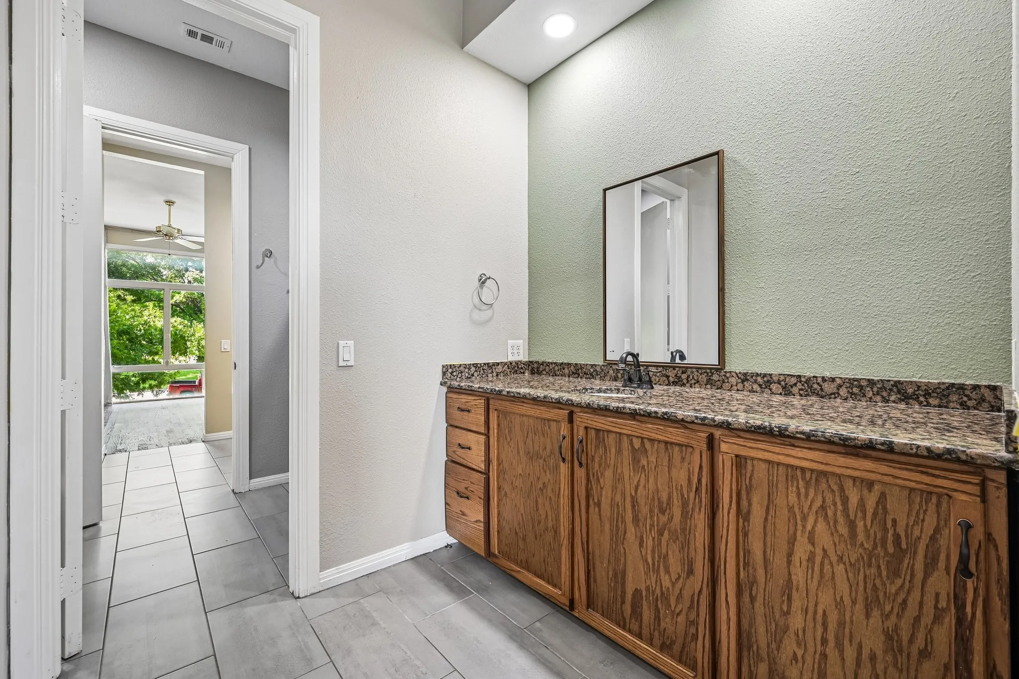 Jack and Jill bathroom with large walk-in closets connects two over-sized bedrooms on the second floor.