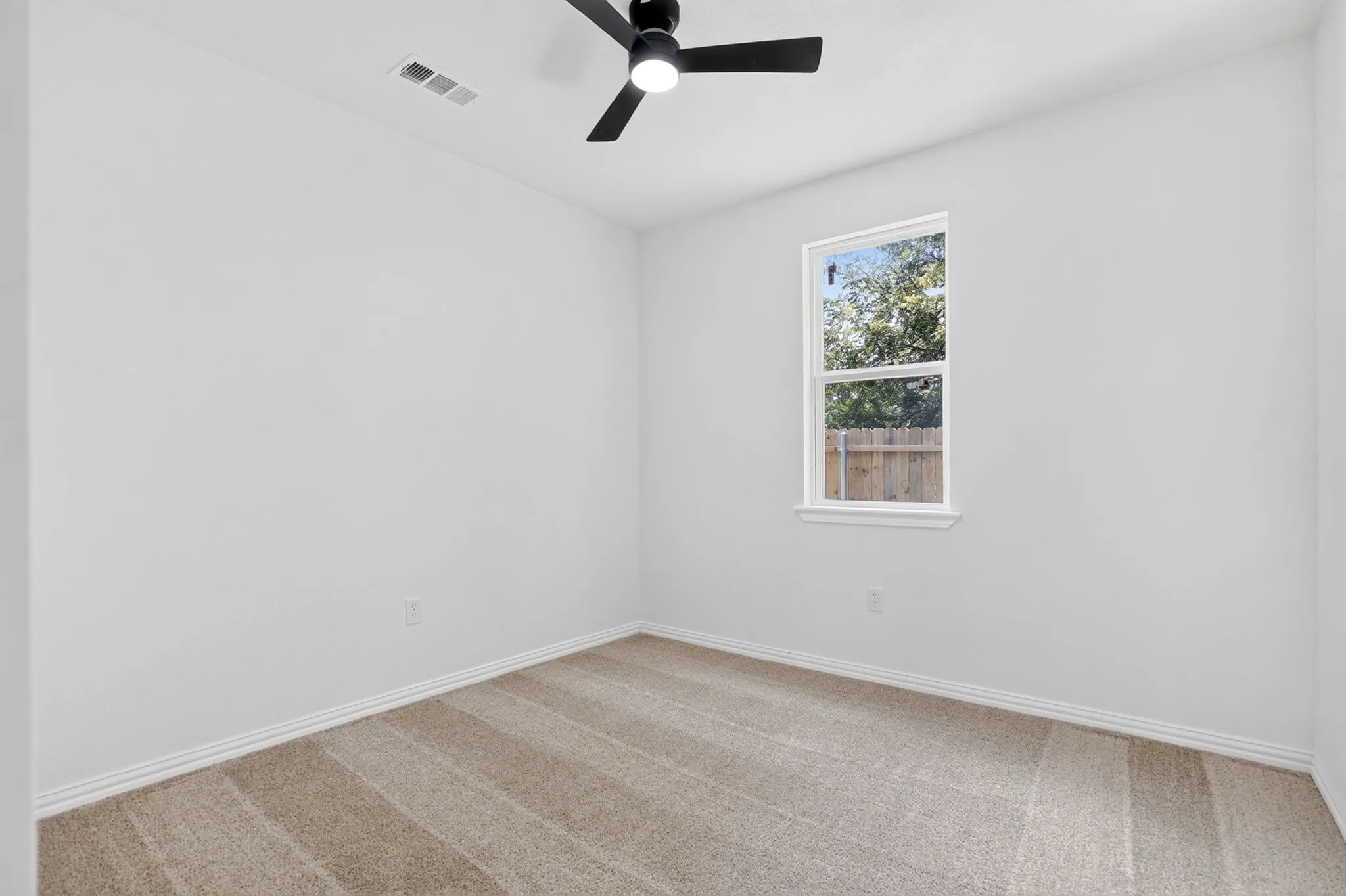Bedroom with carpet floors and ceiling fan