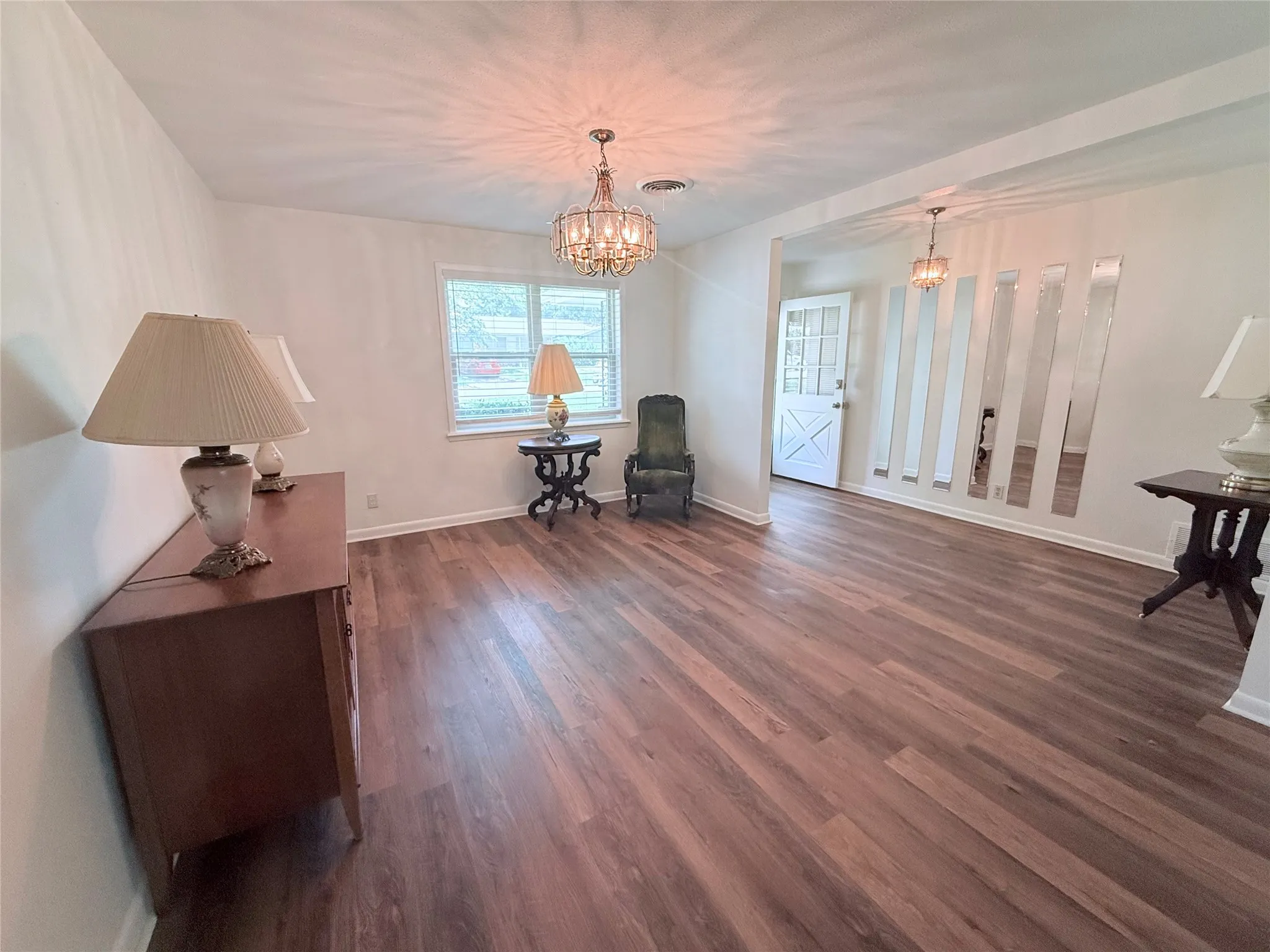Bright interior featuring wood-finish flooring throughout