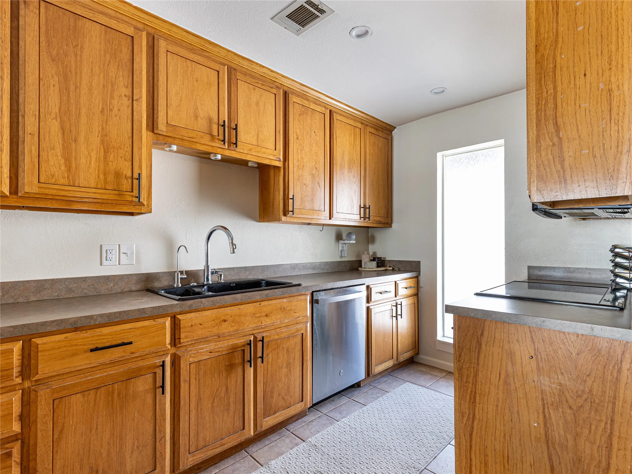 Large kitchen that feels bright, airy, and connected to the outdoors.