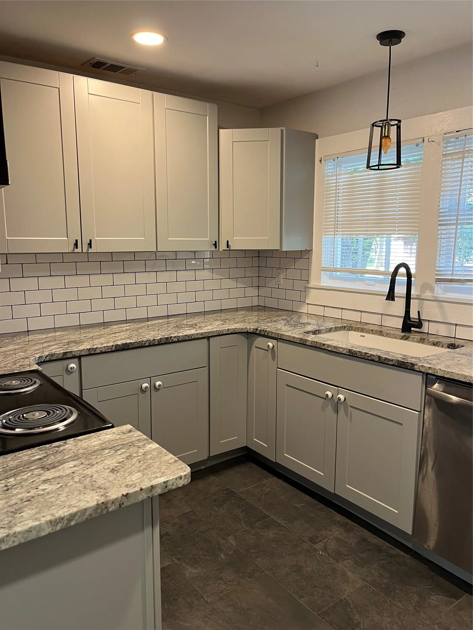 Half of the kitchen with all kitchen appliances included
