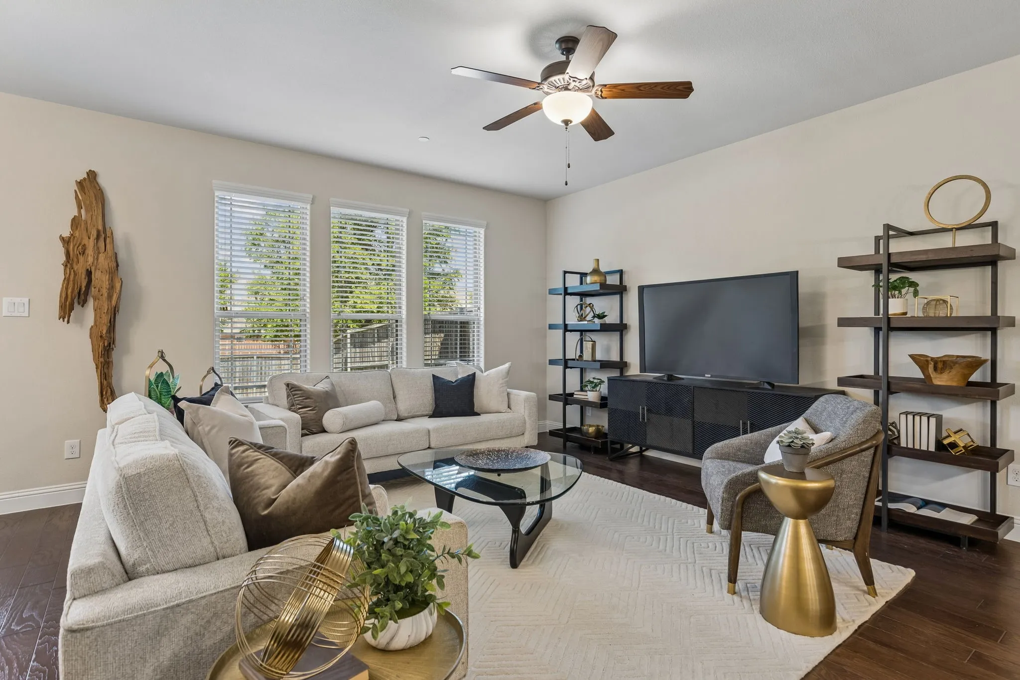 Living area featuring dark wood-finish flooring, light-toned walls, and recessed lighting