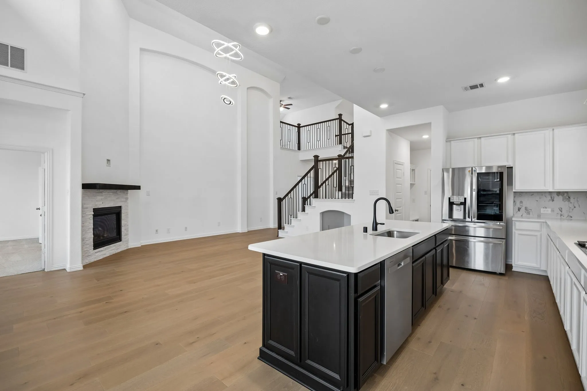 Open-concept living space with wood-finish flooring