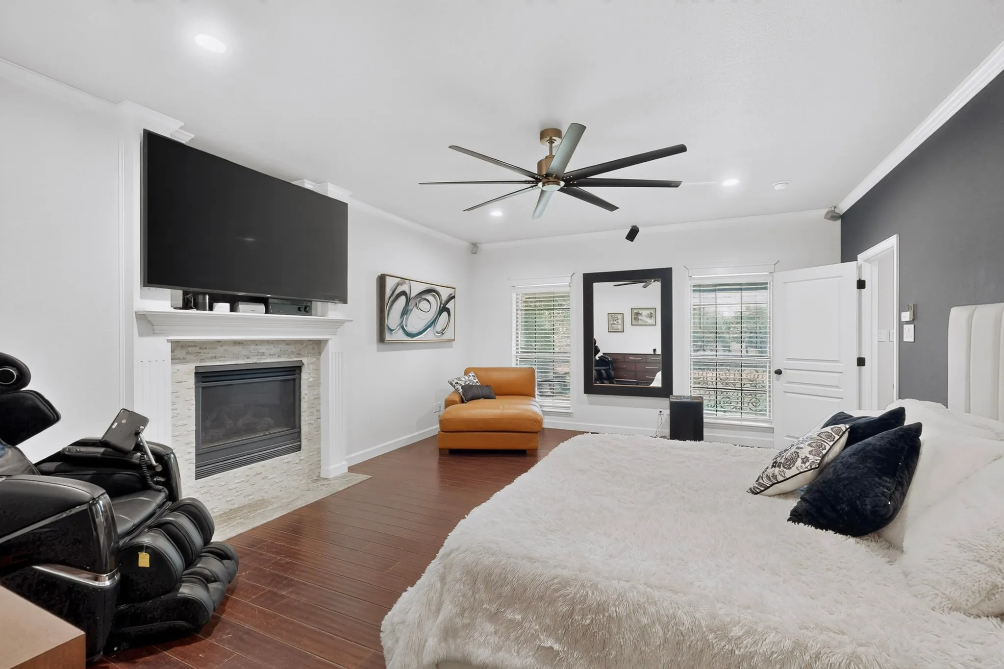 Spacious Primary room featuring wood-finish flooring, a contemporary ceiling fan, and recessed lighting