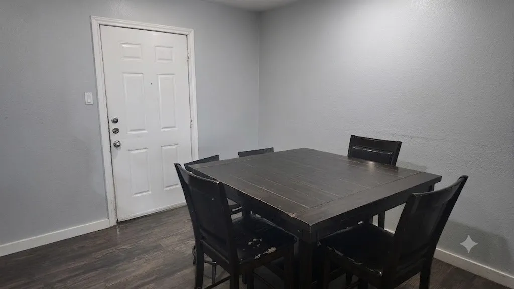 Neutral-toned walls complement wood-finish flooring