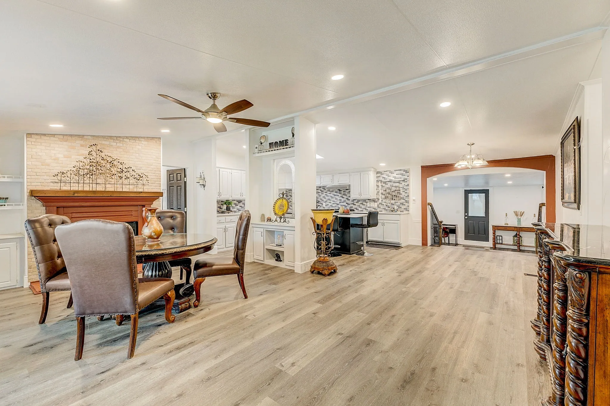 Dining space with ceiling fan and wood-type flooring