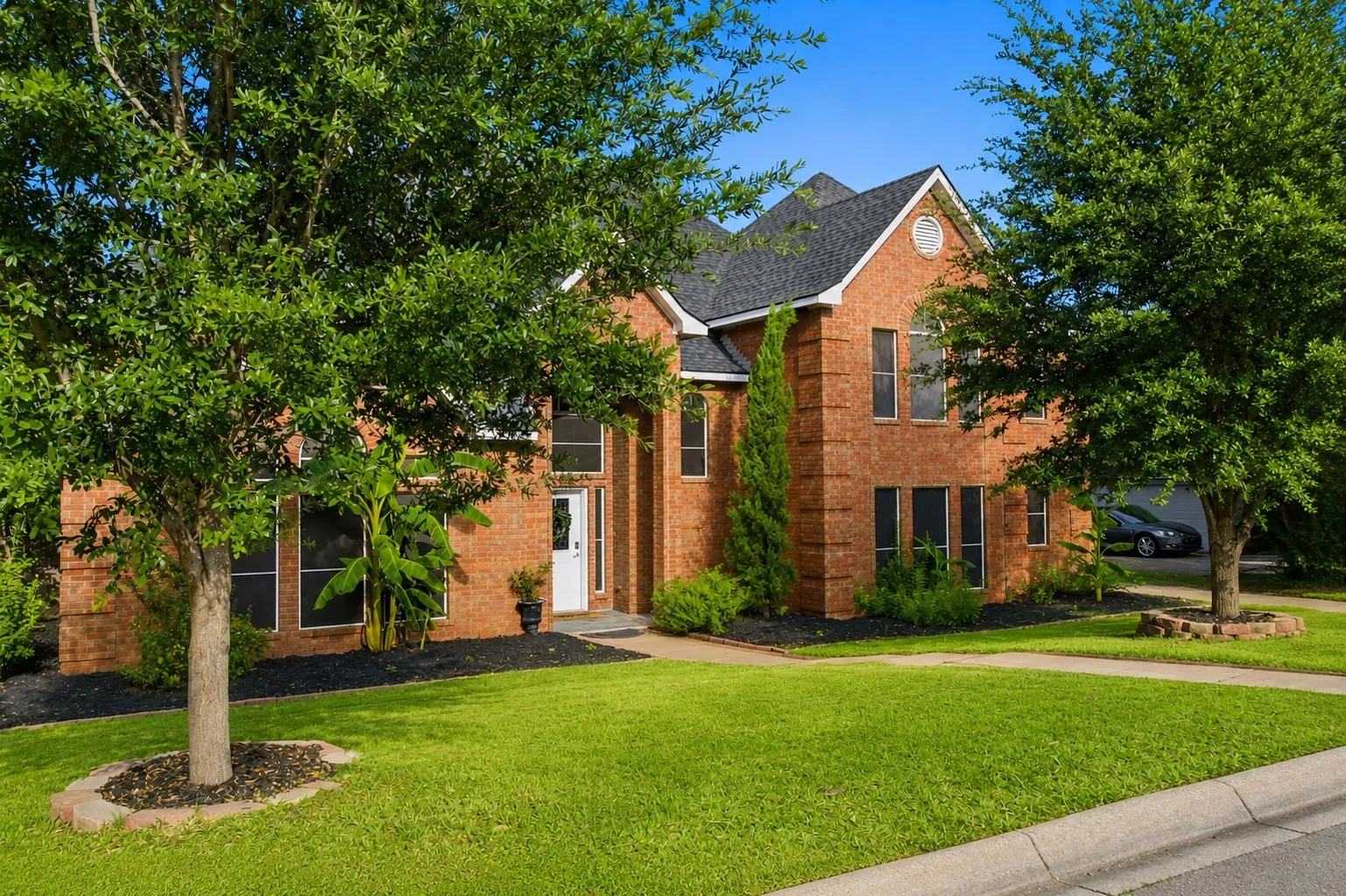 Sitting amongst other beautiful homes, you will love the flower beds & landscaping