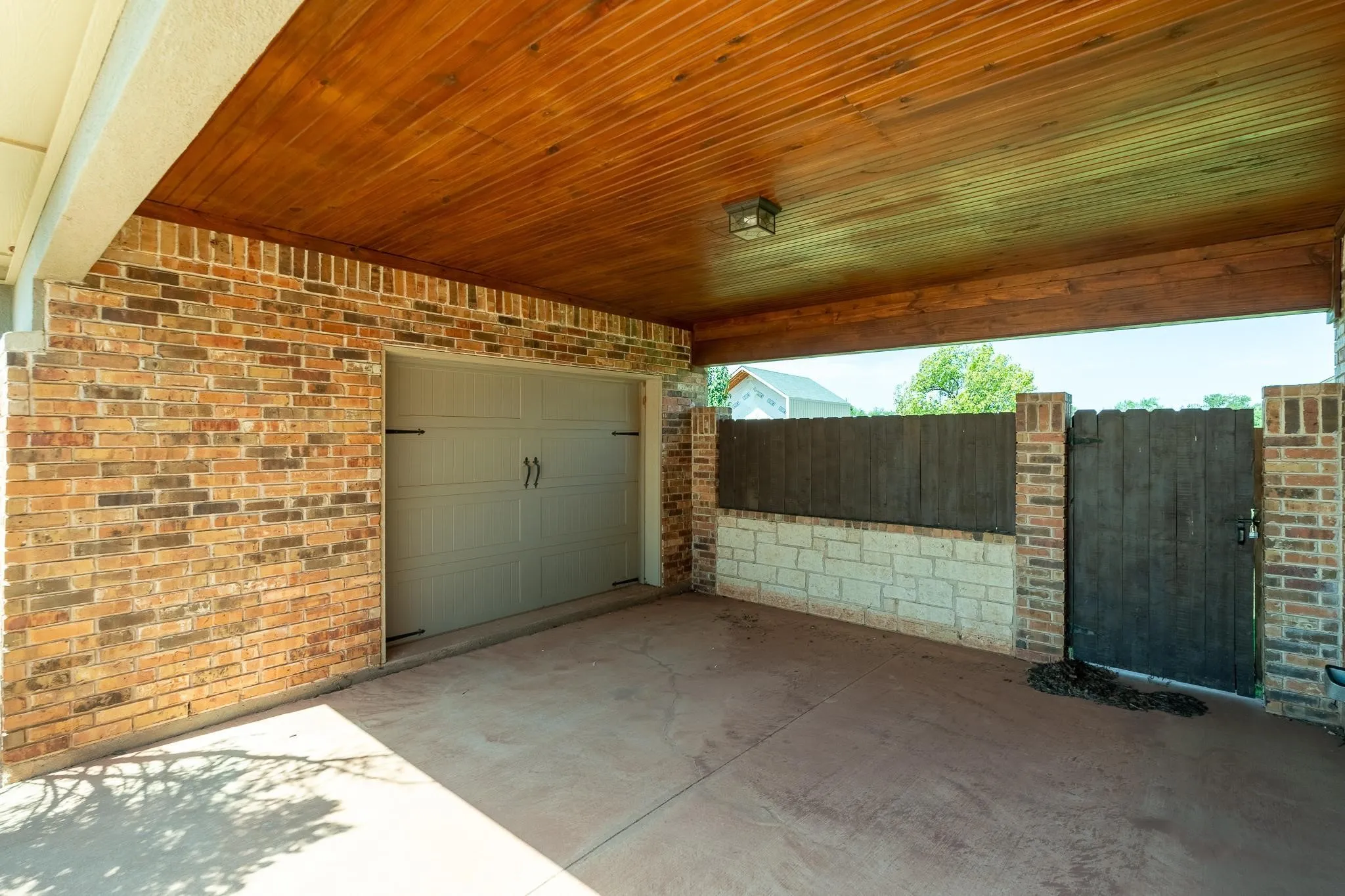 Covered parking and lawn equipment or golf cart garage