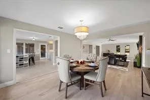 Open-concept interior featuring light wood-finish flooring and neutral wall tones