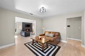 Bright interior space with light wood-finish flooring and neutral wall tones