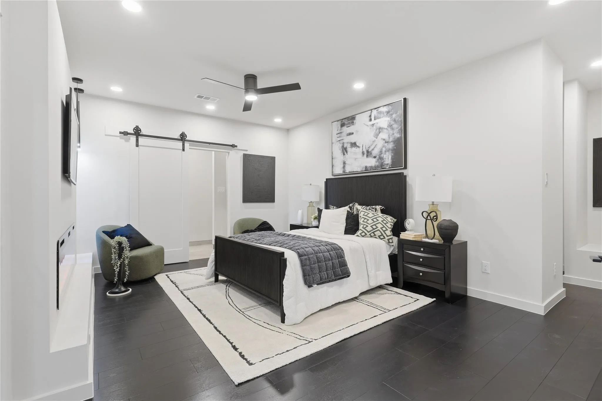Spacious room featuring dark wood-finish flooring, recessed lighting, and a ceiling fan