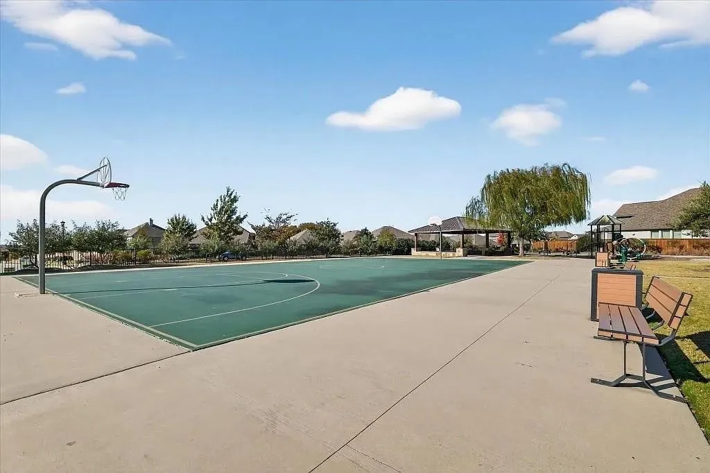 Recreational amenities featuring a basketball court, covered pavilion, and playground