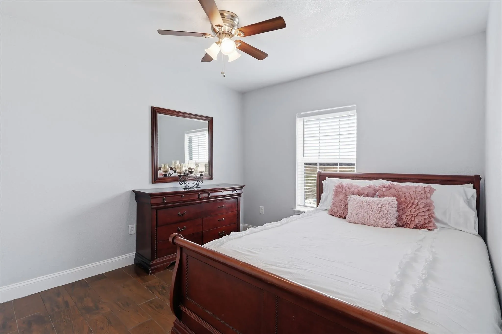 Neutral wall tones with wood-finish flooring