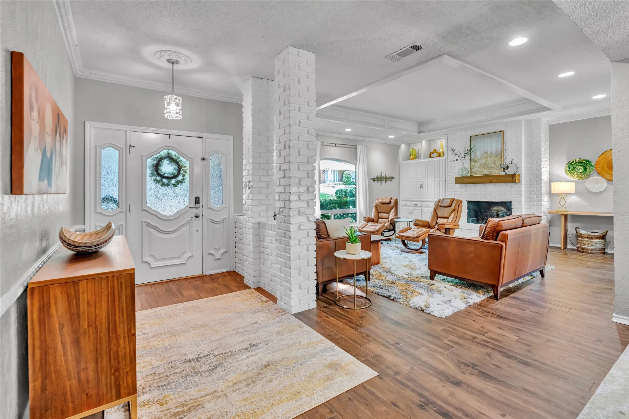 Entry way with gorgeous hardwood look tiled flooring