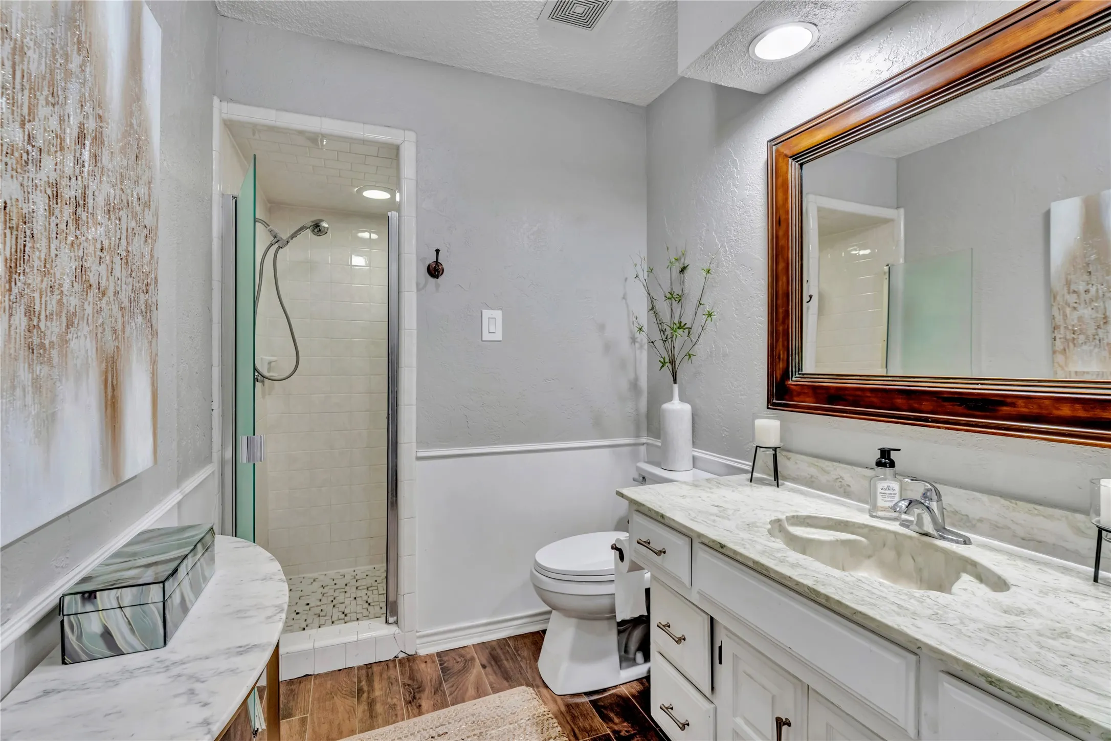 Full bathroom located in the hall near secondary bedroom