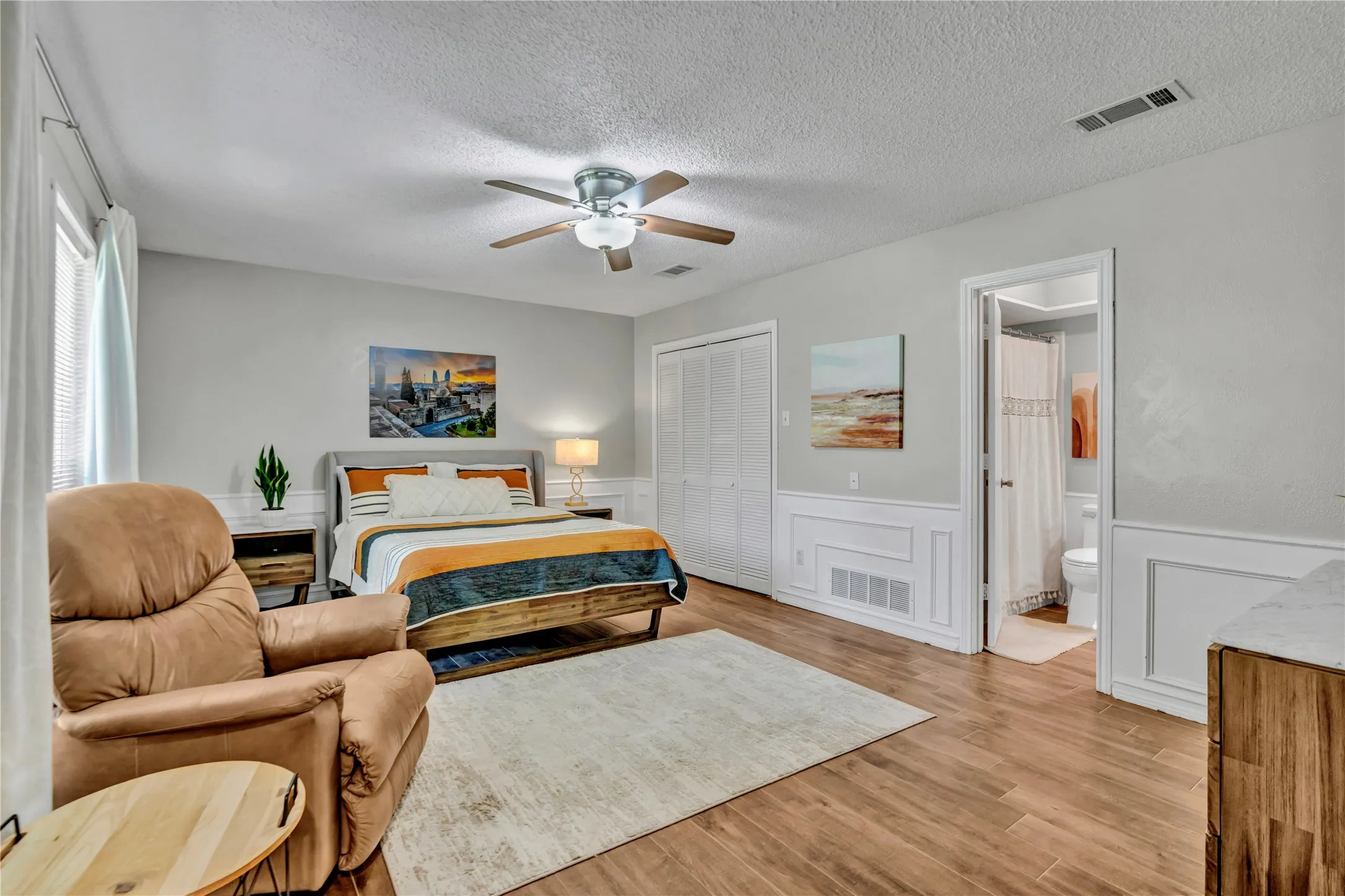 Large family room, currently used as a bedroom with an attached bathroom.  Extra large walk-in closet