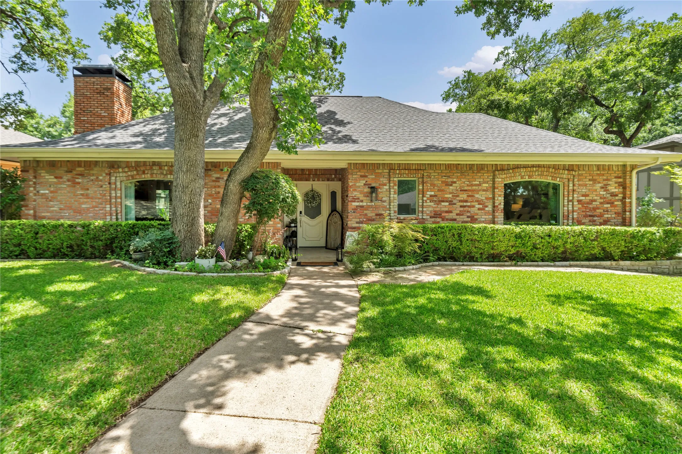 A well maintained home with a lush yard.