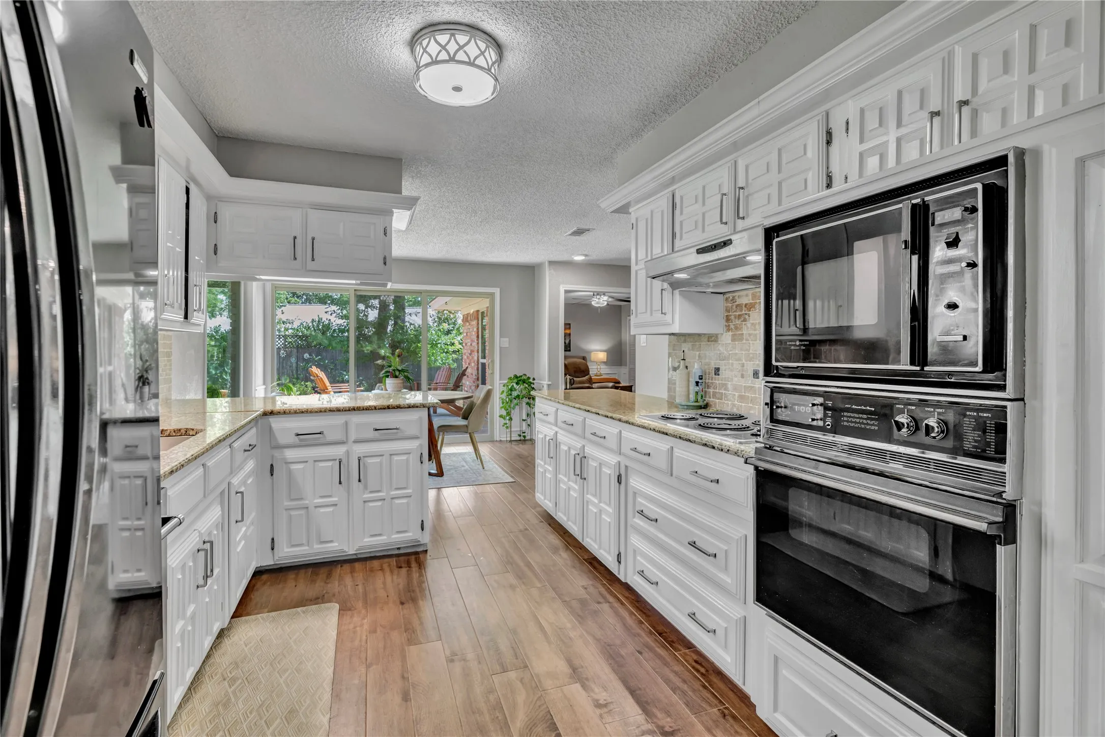 Kitchen is bright and cheerful with Granite counter tops