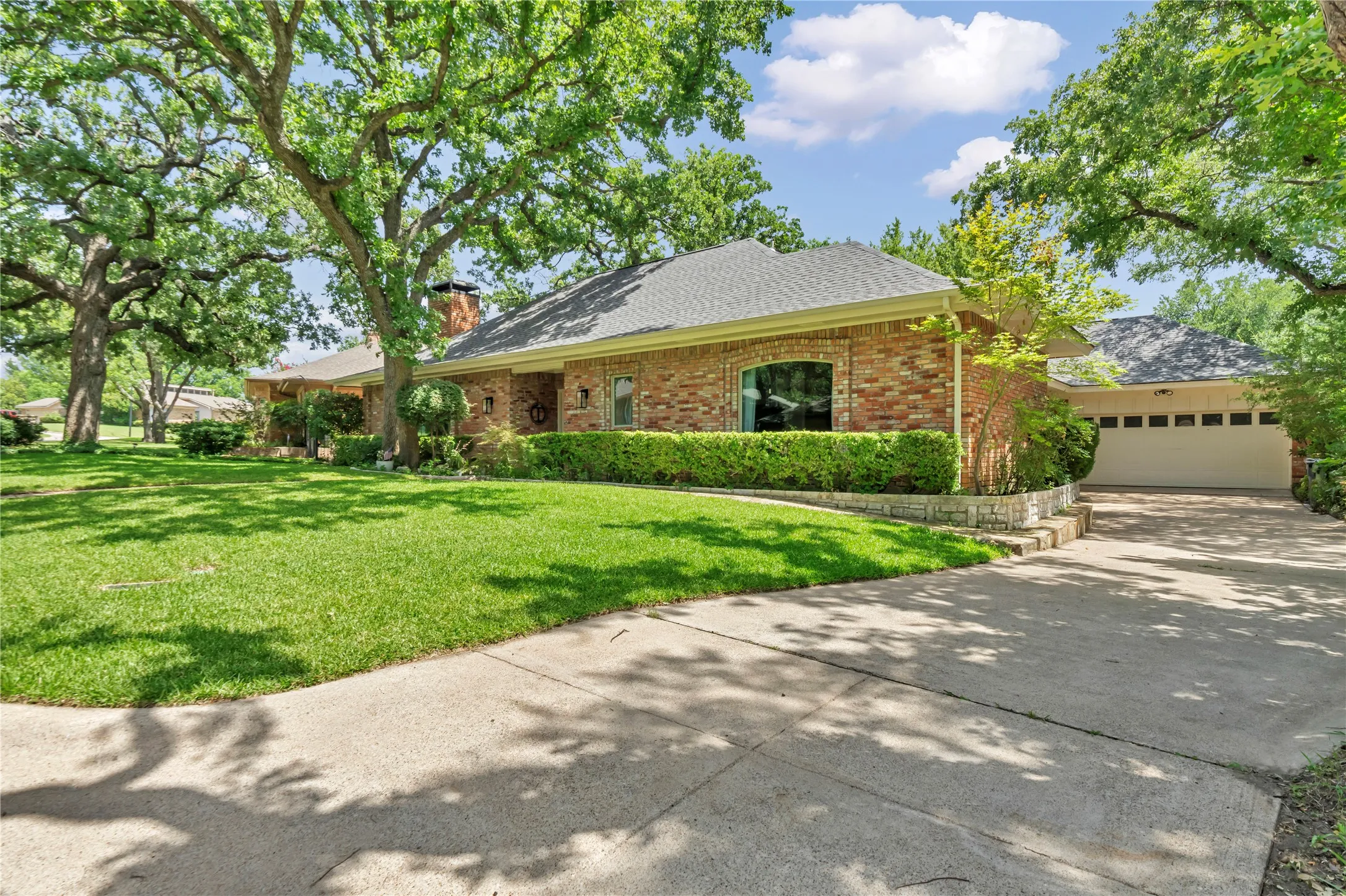 Driveway leads to the attached garage