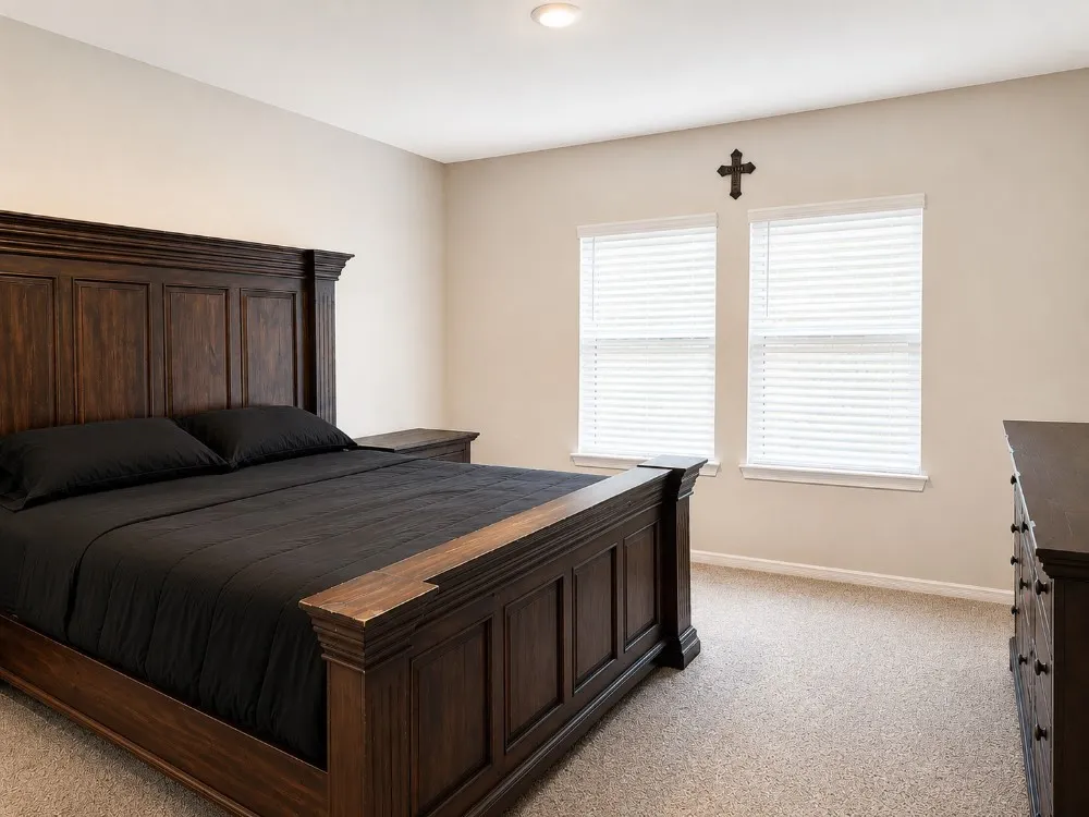 Neutral-toned walls complement the textured carpeting