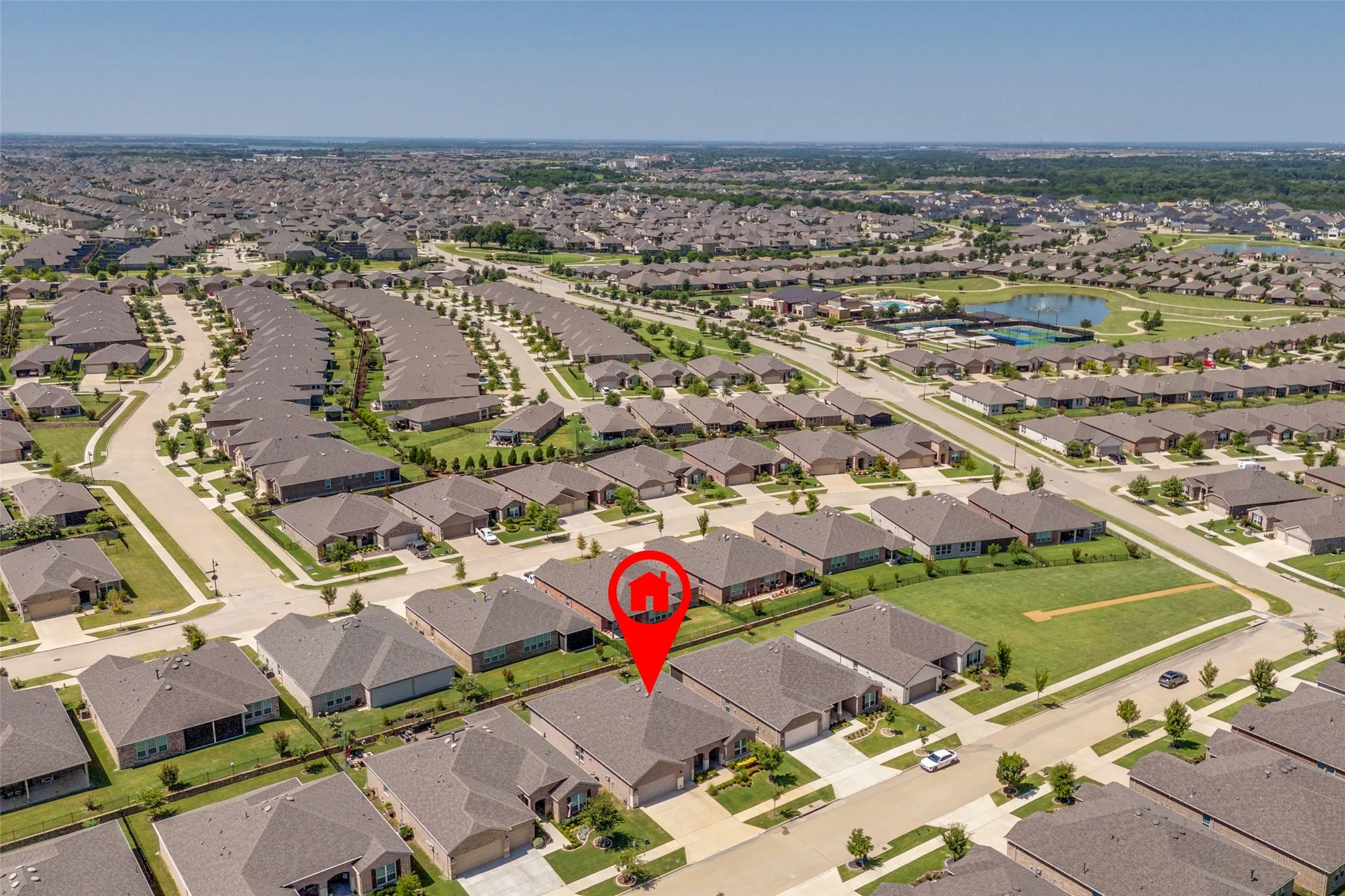 Aerial perspective showcasing a residential neighborhood with numerous single-story homes