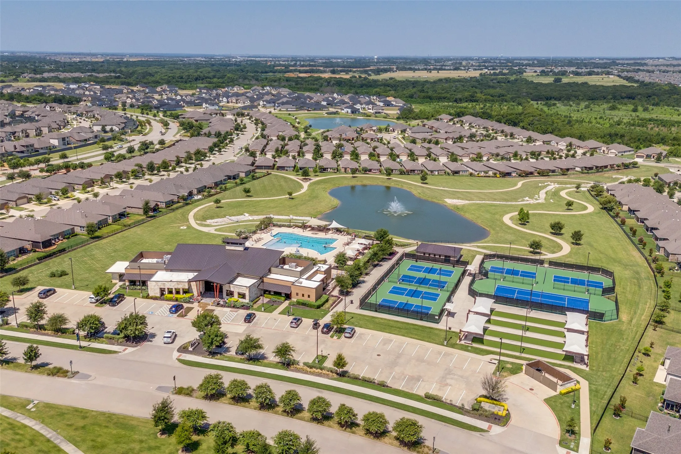 Aerial depiction of a residential community showcasing a central amenity area