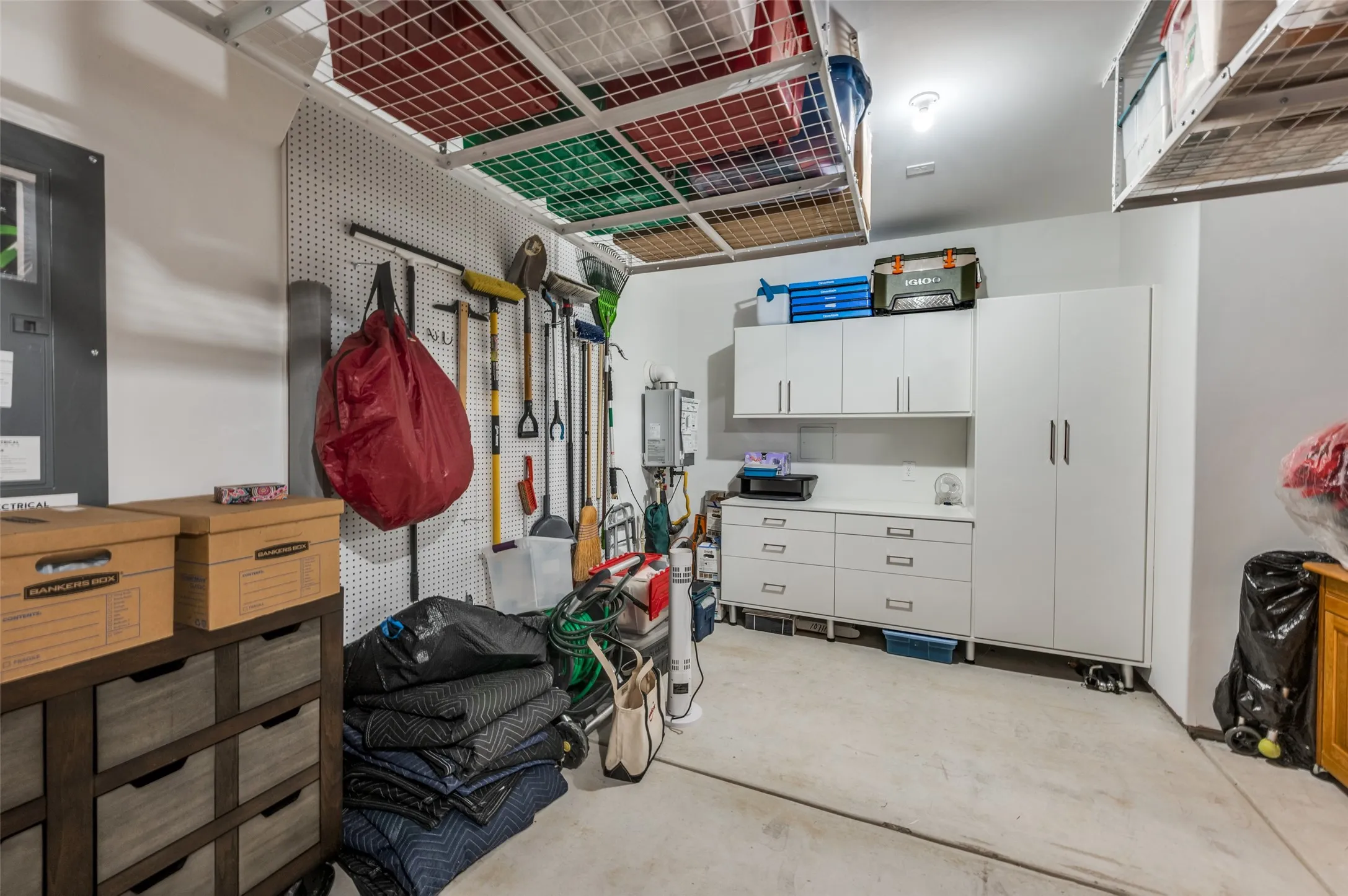 This Large 2.5 car garage has workshop space in the front and another half car garage with powered door for your favorite golf cart or motorcycle! Perfect!