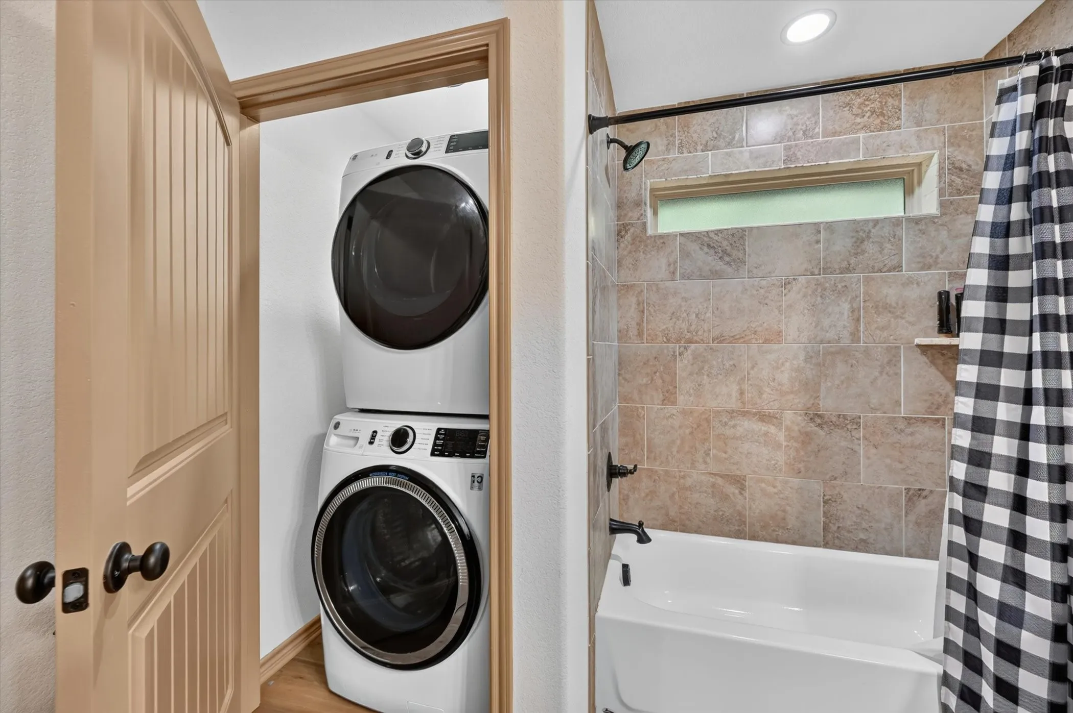 Stackable Washer and Dryer in a closet in the bathroom