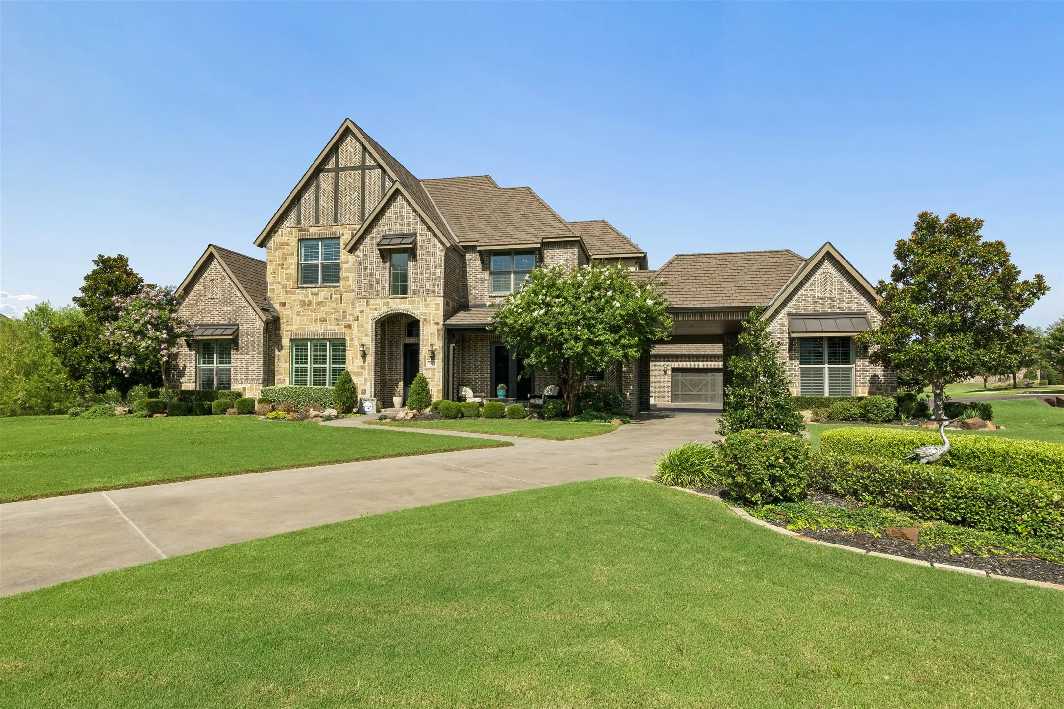 Stone and brick facade with gabled roof lines and decorative timber accents